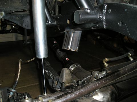 1986 Toyota Hilux - Custom suspension parts are visible, including a shock absorber and driveshaft, suggesting aftermarket modifications.