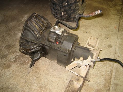 1990 Ford Bronco - A manual transmission assembly, likely for a truck or SUV, is shown removed from a vehicle.