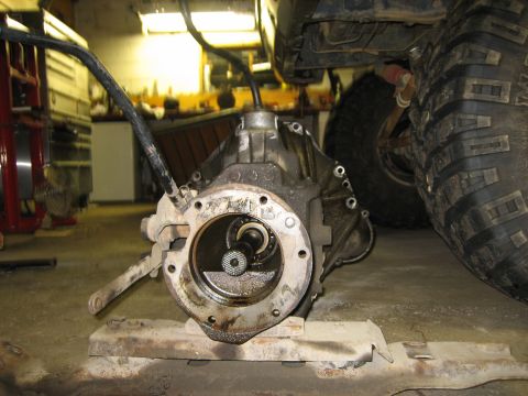 1990 Ford Bronco - Transfer case removed from vehicle, showing internal splines and mounting flange.