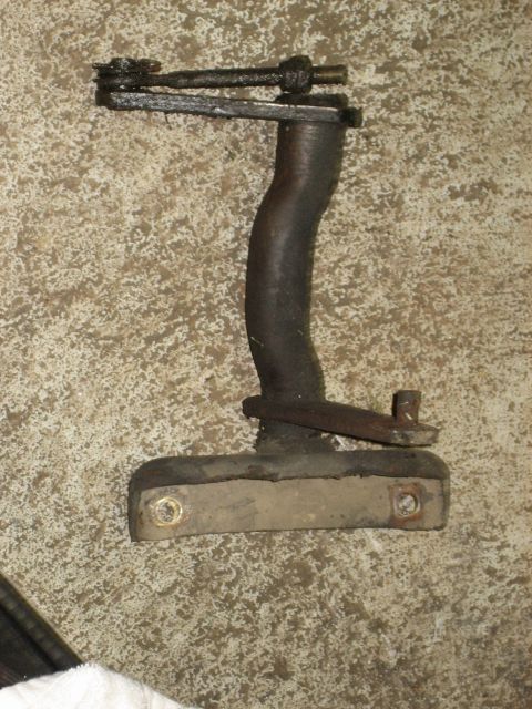 1990 Ford Bronco - Clutch pedal assembly part, likely from a manual transmission vehicle, shown on a concrete surface.
