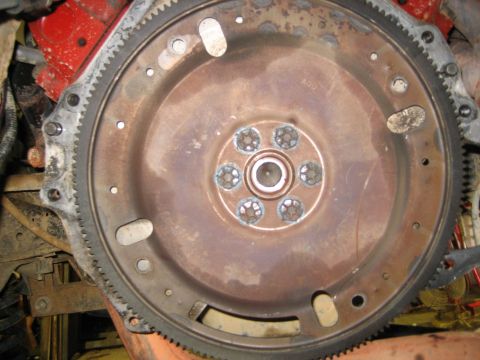 1990 Ford Bronco - This image shows a close-up of a vehicle's engine flywheel, a critical component for power transmission.