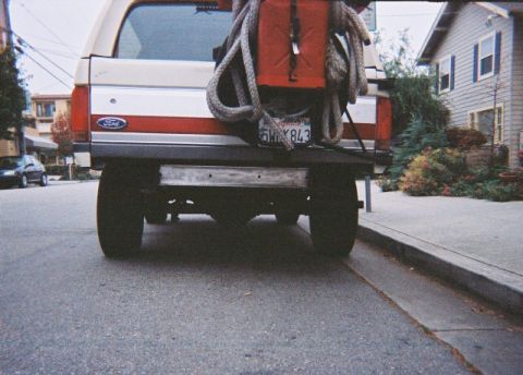1991 Ford Bronco - Rear view of a 1991 Ford Bronco, equipped with a gas can and rope on the tailgate.