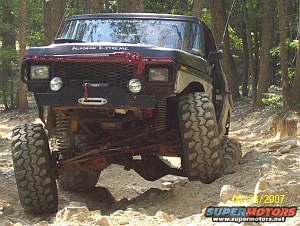 1986 Ford Bronco - This modified Ford Bronco is navigating a challenging off-road course.