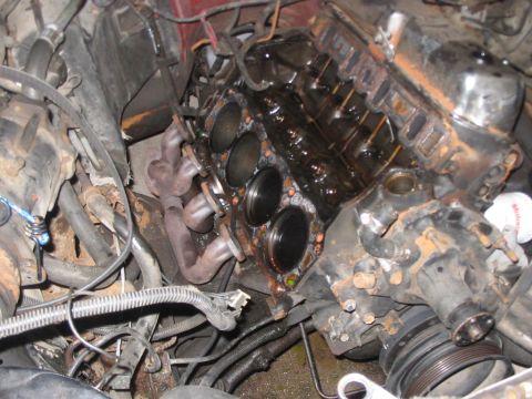1979 Ford LTD - Close-up view of a disassembled engine, showing internal components and surrounding wiring.