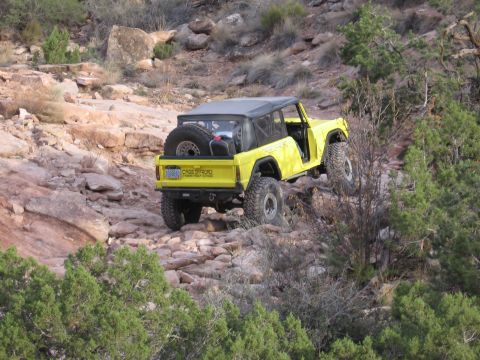 1979 Ford Bronco - Modified 1979 Ford Bronco navigating a challenging rocky terrain.
