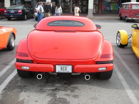 1998 Ford Crown Victoria - Rear view of a red Plymouth Prowler showing dual exhaust and a Louisiana KCO vanity plate at an outdoor show.