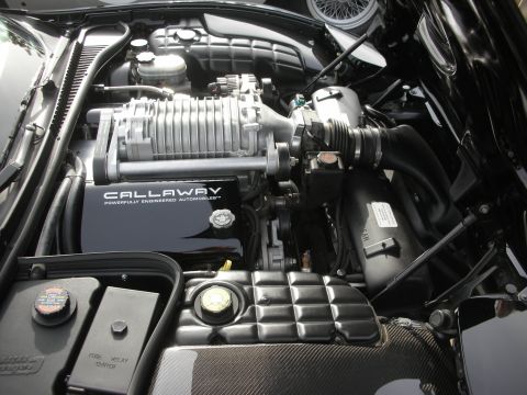 1998 Ford Crown Victoria - Corvette engine bay fitted with a Callaway supercharger and carbon-fiber trim under the open hood.