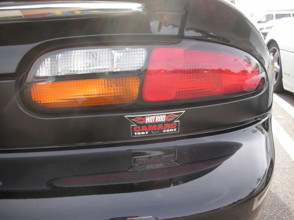 Close-up of a Camaro tail light with a Hot Rod Camaro 1967-2002 sticker