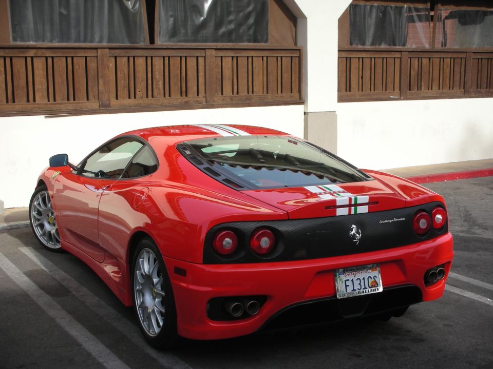 Rear of a red Ferrari 360 Challenge Stradale with Italian-flag stripe