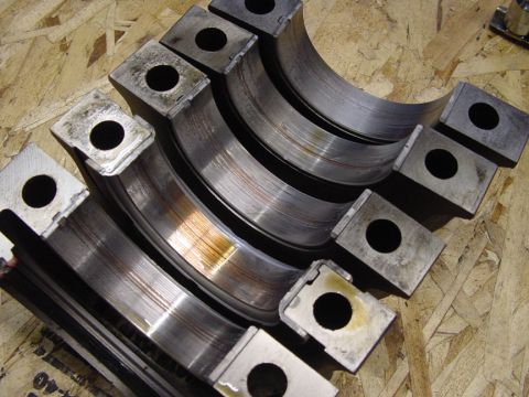 1979 Ford Bronco - Damaged engine bearing shells are shown, indicating significant wear and potential failure.