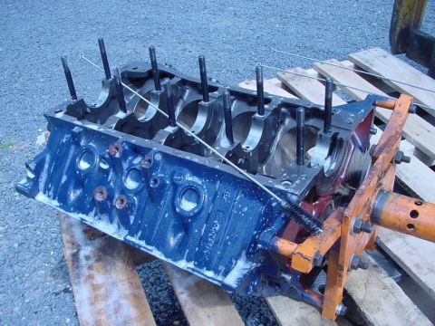 1979 Ford Bronco - Engine block undergoing cleaning and repair, detached from any vehicle.