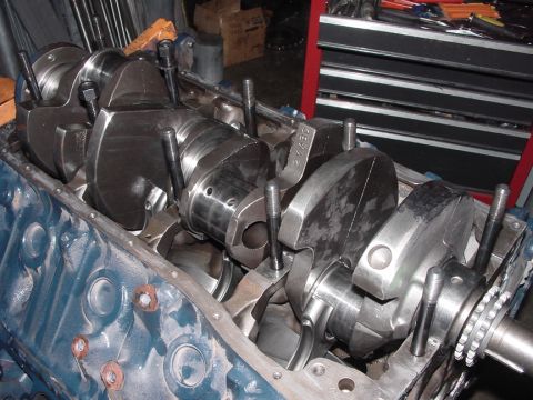 1979 Ford Bronco - Close-up view of a rebuilt engine crankshaft with connecting rods installed in the engine block.