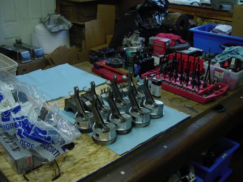 1979 Ford Bronco - Engine parts are organized on a workbench, suggesting a rebuild or repair process.