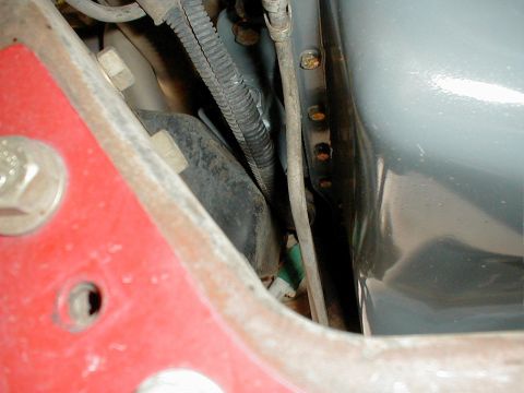 1996 Ford Bronco - Detail shot of vehicle undercarriage components, including wiring and frame structure.