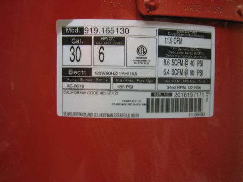 1994 Ford Bronco - A label on a red compressor details its specifications, including capacity, horsepower, and pressure ratings.