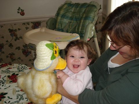 2000 Ford Crown Victoria - A baby and a stuffed duck are shown together in a domestic setting.