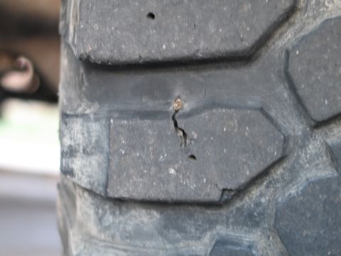 1995 Ford Bronco - Put a good sized nail through this one. No wonder it's leaking.
