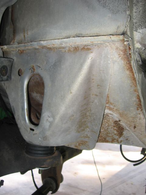 1979 Ford F-150 - Underside view of vehicle frame and suspension components, showing rust and wear.