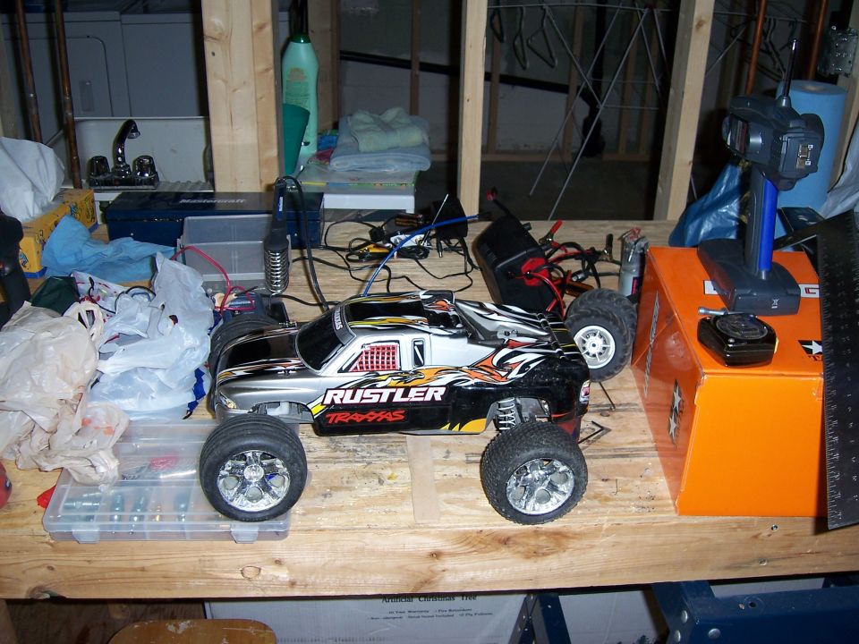 Remote control monster truck with 'Rustler Traxxas' graphics