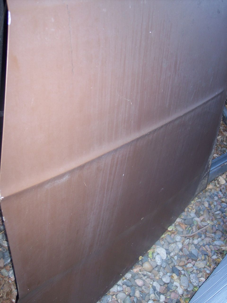 brown car door with a horizontal body line