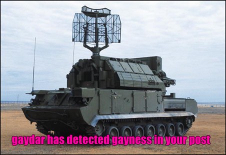 2003 Jeep TJ - A tracked radar vehicle is shown in a field. Text superimposed on the image reads 'gaydar has detected gayness in your post'.