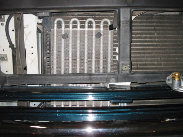 Close-up of vehicle's front radiator and AC condenser assembly