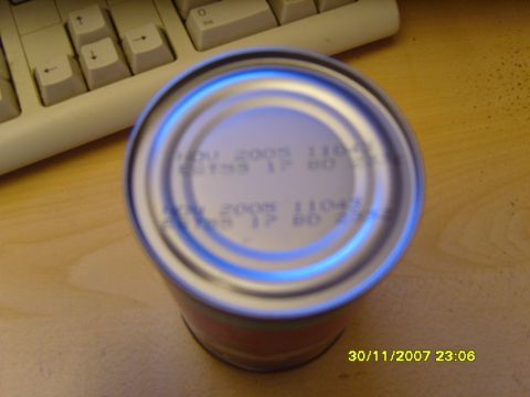 1989 Ford Bronco - A tin can sits on a desk next to a keyboard, displaying printed expiration dates.