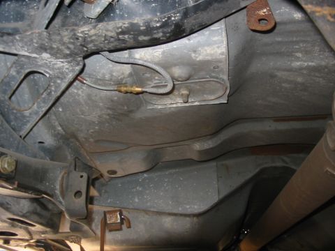 1985 Ford Crown Victoria LTD - Undercarriage view showing suspension components and exhaust system.