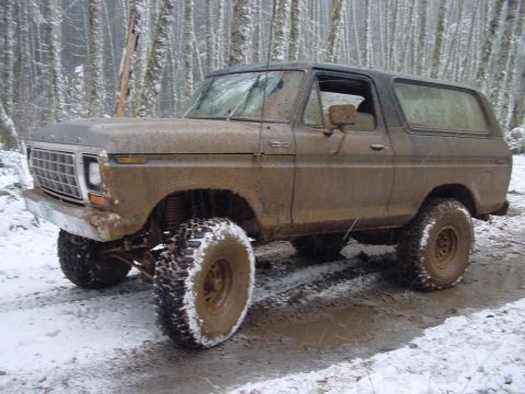 1979 Ford Bronco - This 1978 Ford Bronco is covered in mud and driving through a snowy forest.