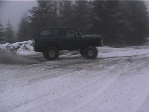 1979 Ford Bronco - This 1979 Ford Bronco is captured driving on a snowy road.
