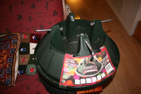 2003 Jeep TJ - A green Christmas tree stand is shown with a label indicating it is for trees up to 8 inches in diameter.