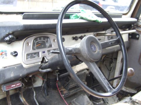 1976 Toyota Land Cruiser - Interior view of a 1976 Toyota Land Cruiser, showing the dashboard, steering wheel, and gauges.