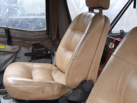 1976 Toyota Land Cruiser - Interior view of tan leather bucket seats with headrests.