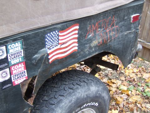 1976 Toyota Land Cruiser - This vehicle has stickers for "Coal Mine Cruiser Classic 2001" and "Coal Mine Cruiser Classic 2000" on its rear.