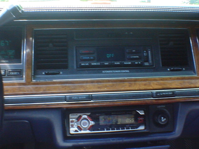 Lincoln Town Car dash: automatic climate control panel and aftermarket Sony CD head unit