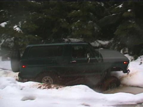 1979 Ford Bronco - Ford Bronco stuck in mud and snow during winter off-roading.