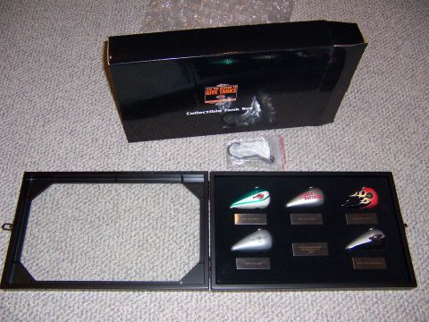 1987 Ford Bronco - Collectible Harley-Davidson tank set with six miniature tanks displayed in a case.