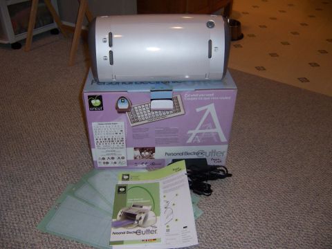 1987 Ford Bronco - A Cricut Personal Electronic Cutter is displayed with its packaging and accessories.