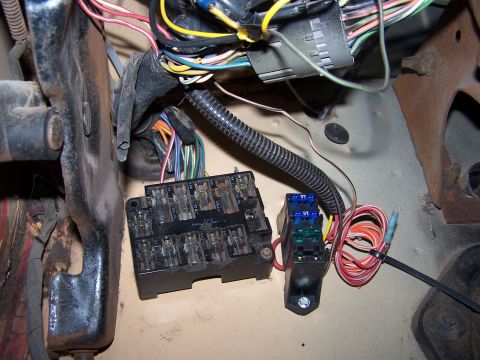 1979 Ford Bronco - Close-up of a vehicle's electrical system, showing fuse boxes and wiring.