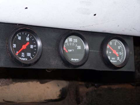 1979 Ford Bronco - A trio of automotive gauges, including oil pressure, temperature, and boost, are visible.