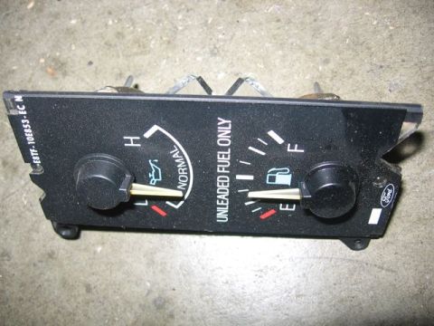 1989 Ford Bronco - This gauge cluster displays fuel level and oil temperature, the Ford logo.