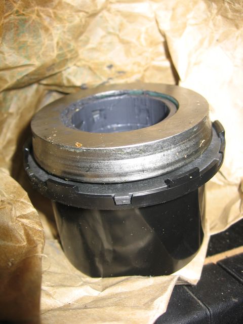 1989 Ford Bronco - Unidentified automotive part shown in detail, wrapped in protective paper packaging.