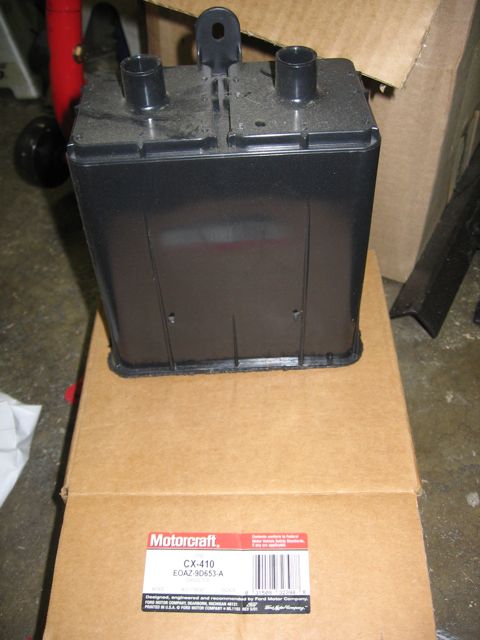 1989 Ford Bronco - A Motorcraft CX-410 part is shown resting on two cardboard boxes.