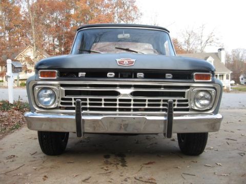 1966 Ford F-100 - The grille design and headlights indicate this Ford truck is likely a 1965 model, not a 1966.