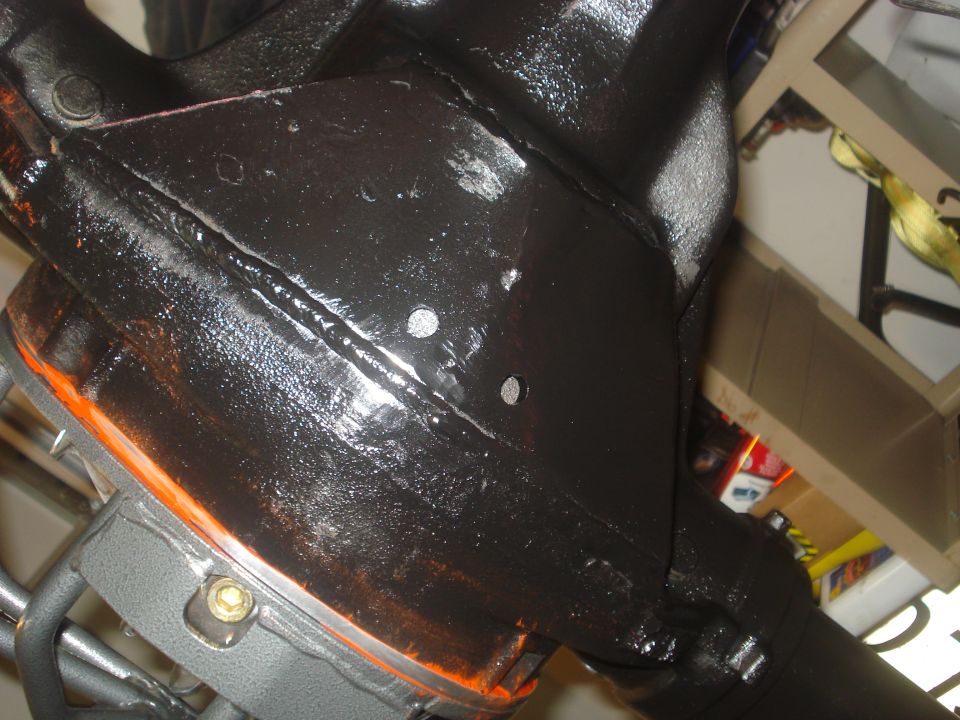 Freshly painted black differential housing with reflective wet finish
