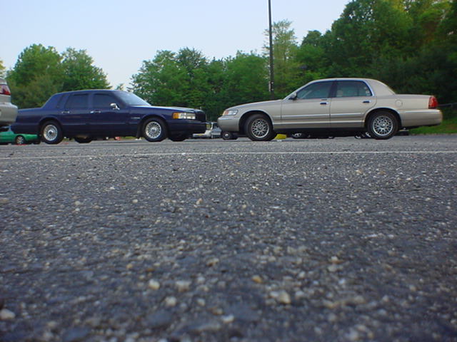Side view of a 1994 Lincoln Town Car and another sedan