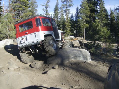 1986 Ford Bronco - This off-road vehicle is shown navigating a challenging rocky trail.