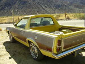 1970 Ford Ranchero - This 1970 Ford Ranchero pickup truck is shown in a desert setting with mountains in the background.