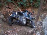 1992 Ford Mustang - This off-road buggy navigates a challenging, rocky incline covered in fallen leaves.