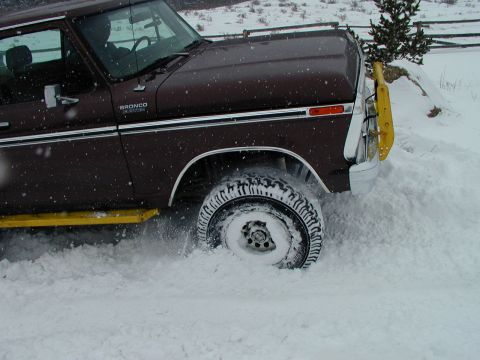 1979 Ford Bronco - Ford Bronco with plow attachment navigates through heavy snow.